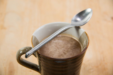 Coffee cup isolated on wood  background.