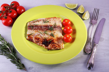 Dish of Pangasius fillet with rosemary and cherry tomatoes in
