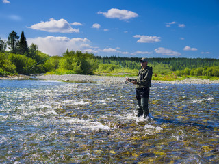 A fisherman on the river