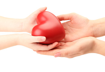 Heart in child and mother hands isolated on white