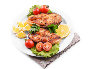 Tasty baked fish on plate isolated on white