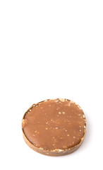 Round palm sugar over white background