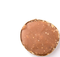 Round palm sugar over white background