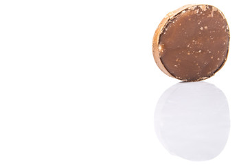 Round palm sugar over white background