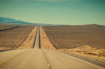 Fototapeta na wymiar Long Straight Road in Wyoming USA