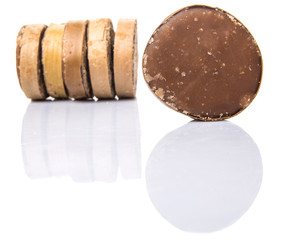 Round palm sugar over white background
