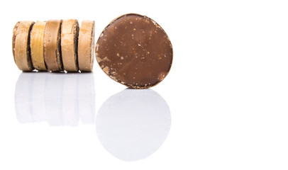 Round palm sugar over white background
