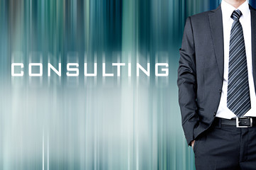 Fototapeta premium CONSULTING sign on blur background with businessman