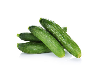 fresh green baby cucumbers on white background