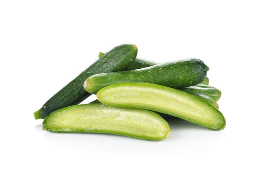 fresh green baby cucumbers on white background