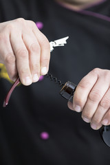 opening a bottle of wine.