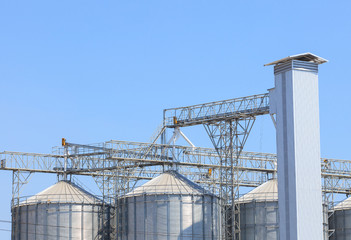 exterior structure of new agriculture silo building against blue