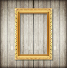 Antique picture frame on wooden wall ;. Empty picture frame on w