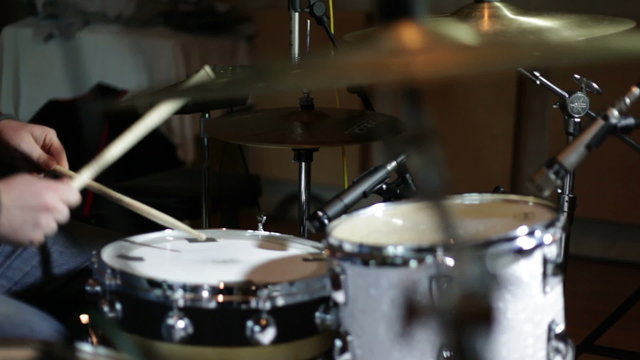 close up shot of musican playing drums