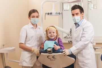 back view of little girl at dentist chair.