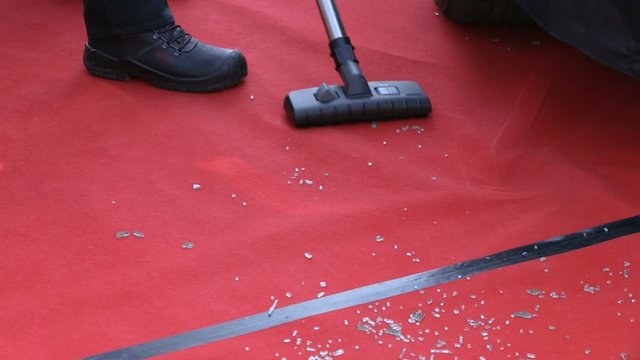 Vacuuming small pieces of fractured broken glass