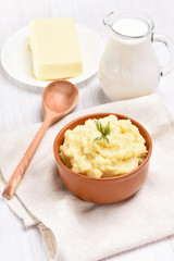 Mashed potato, jug of milk and butter