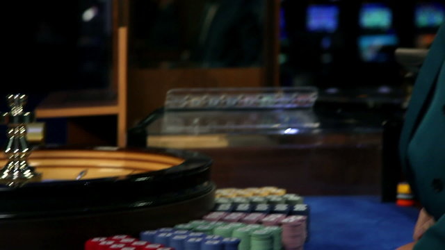 Attractive young people betting at roulette