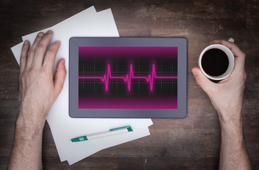 Electrocardiogram on a tablet - Concept of healthcare