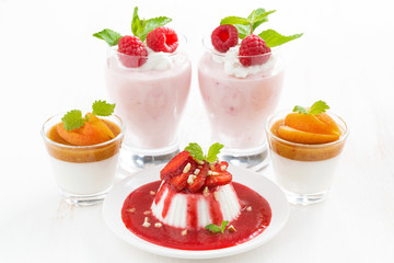 assortment of desserts with cream jelly and fresh berries