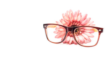glasses and bunch of flowers on a white background