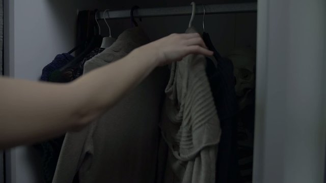 Woman can't decide what clothes to wear