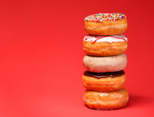 Sweet donuts on red background