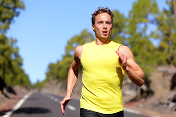 Running man sprinting for success on run