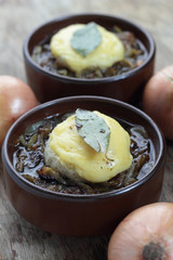 French onion soup with toast and melted cheddar on top.