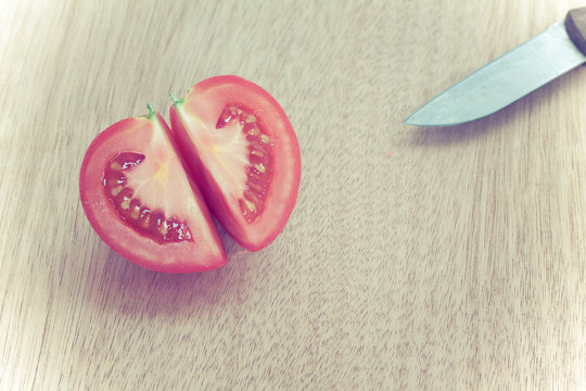 Half cut cleave of red potato,look llike heart shape,with knife