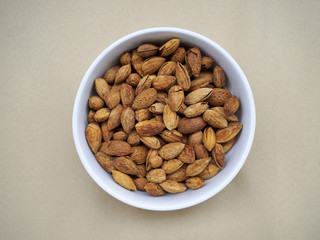 Bowl of almonds on canvas - 77447174