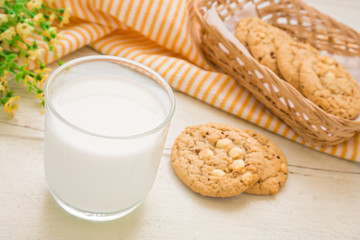 Milk glass and white chocolate chip cookie