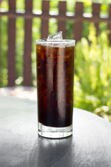 Iced Americano on wood table.