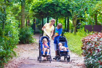 Mother with three children in a park