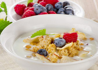 Healthy breakfast - yogurt with muesli and fresh berries