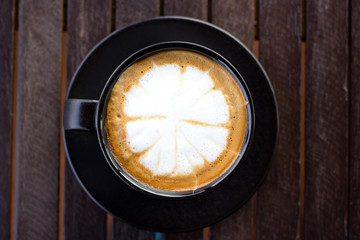 Cup of art latte or cappuccino coffee.