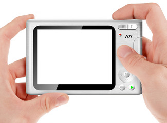 Hand holding a compact digital camera with empty LCD screen