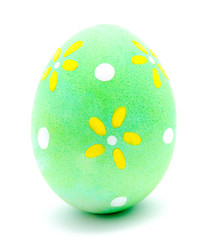 Painted green easter egg isolated on a white
