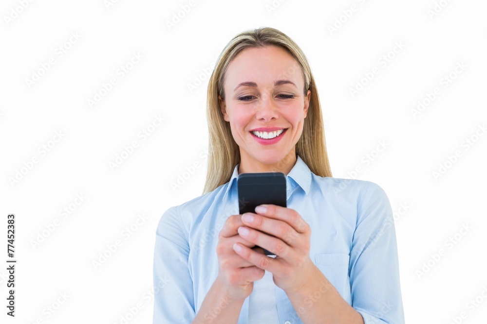 Poster Smiling blonde sending a text message