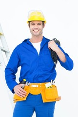 Happy electrician with wires against white background