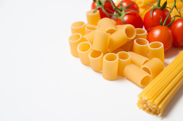 Varius kind of pasta with tomatoes on white background