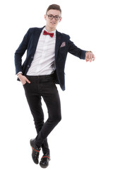 Full length portrait of confident young businessman leaning on i