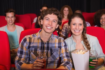 Young couple watching a film