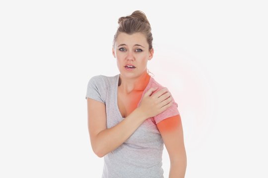 Portrait of woman suffering from shoulder pain