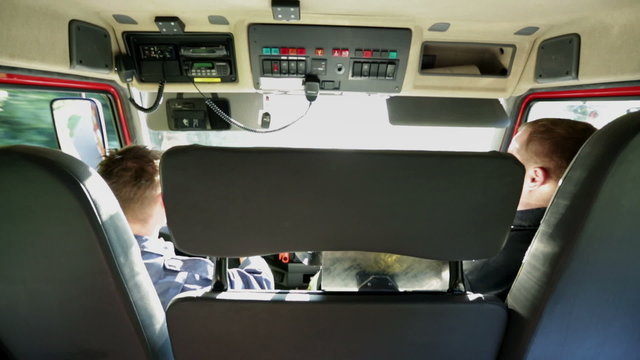 Firetruck cockpit with two firemen