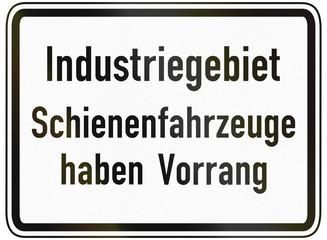 German traffic sign additional panel to specify the meaning of other signs: Industrial area - Trains have priority