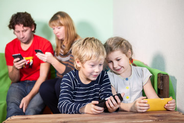 Children and parents playing games on smartphones