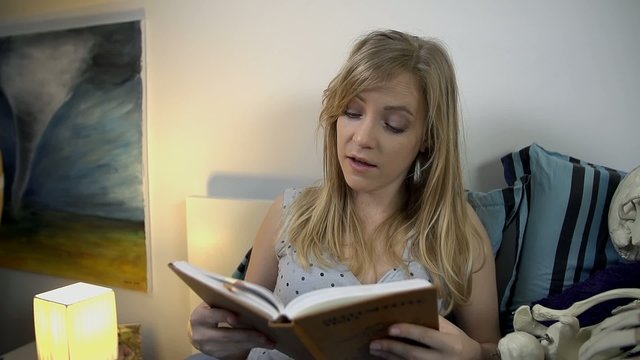 Girlfriend reads to her boyfriend