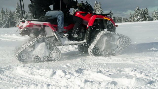 a motor sledge driving in the winter time