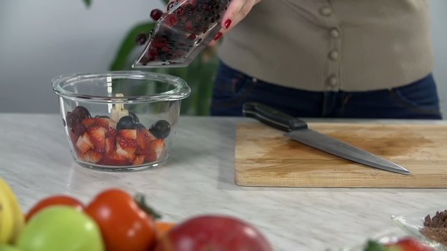 Moving berries in to a glass bowl
